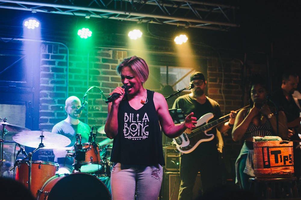 Female singer performing with a band in Bourbon Street, New Orleans, Louisiana
