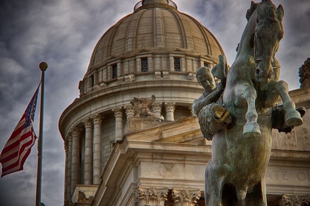 Statue of Buffalo Bill Cody and the Oklahoma City State Capitol